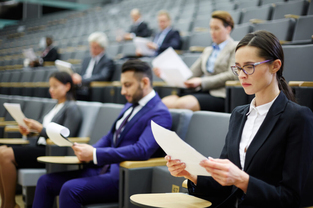 people in an planning commission meeting, reading a document together